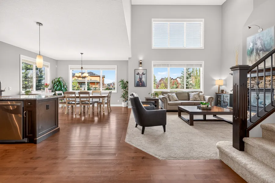 Vaulted living room open to kitchen and dining