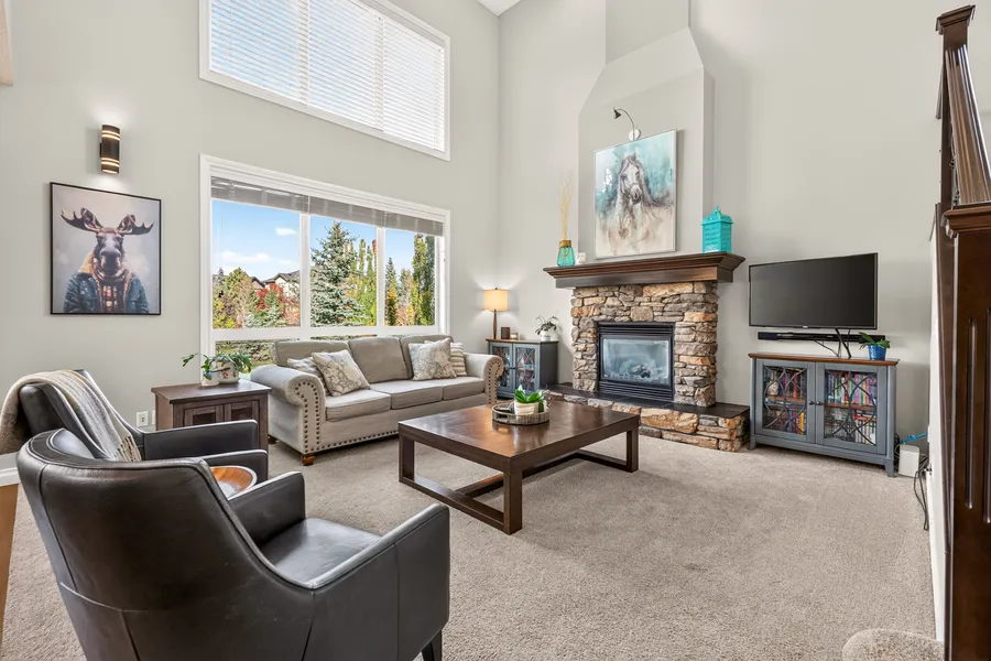 Living room, gas fireplace and tall windows