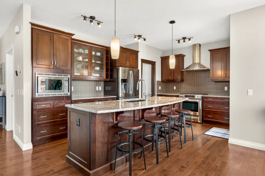 Kitchen island with granite counters and seating