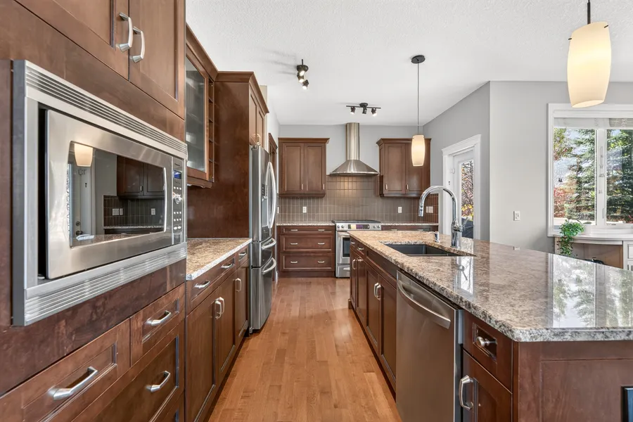 Built-in microwave and glass-front cabinetry
