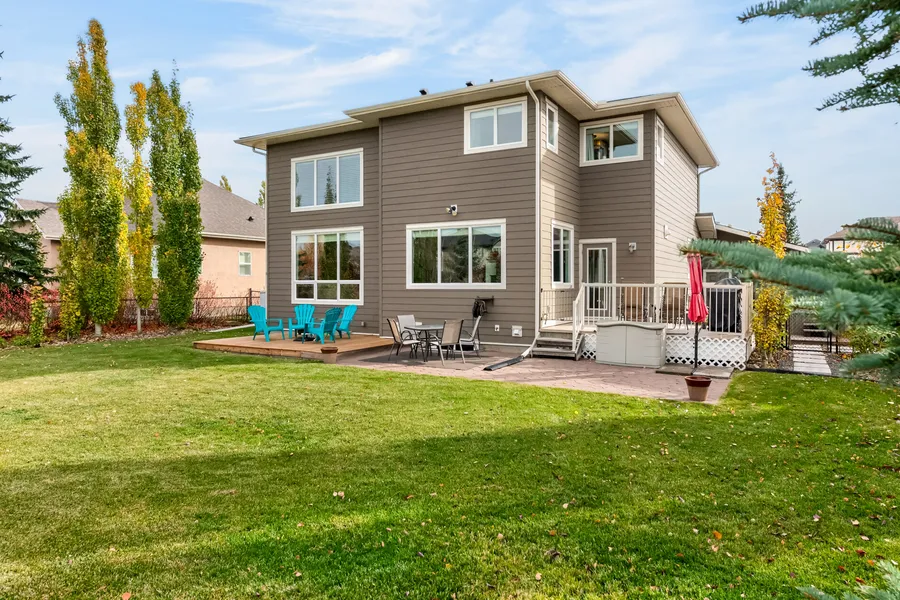 Fenced backyard, backing green space